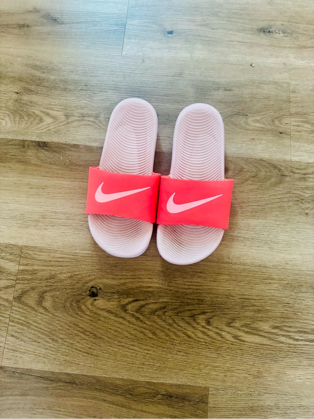 Nike Coral-Pink Slide Sandals with White Swoosh